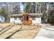 A well-maintained single-story house with charming wooden shutters and a cozy porch at 3687 Venus Nw Pl, Atlanta, GA 30331