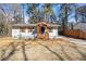 Attractive single-story home with a blue door and a well-maintained front yard at 3687 Venus Nw Pl, Atlanta, GA 30331