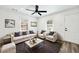 Bright living room with neutral furniture, a ceiling fan, and lots of natural light at 3687 Venus Nw Pl, Atlanta, GA 30331