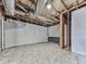 Bright basement featuring concrete floor, paneled walls and some exposed ceiling at 5228 Boone Ct, Villa Rica, GA 30180