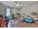 Playful bedroom with a tent bed, stuffed animals, and wood floors at 5228 Boone Ct, Villa Rica, GA 30180