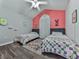 Charming ' bedroom featuring twin beds, colorful decor, and a playful rug at 5228 Boone Ct, Villa Rica, GA 30180