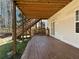 Spacious wooden deck with stairs leading to a fenced backyard, ideal for outdoor relaxation at 5228 Boone Ct, Villa Rica, GA 30180