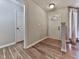 Inviting entryway with a wood-look flooring and a bright, modern door at 5228 Boone Ct, Villa Rica, GA 30180