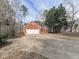 Brick home with attached two-car garage and an extra-long concrete driveway at 5228 Boone Ct, Villa Rica, GA 30180
