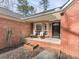 Inviting front porch with chairs, decorative plants, and brick accents at 5228 Boone Ct, Villa Rica, GA 30180
