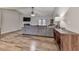 Spacious living room featuring vaulted ceilings, wood-look floors, and a gray sofa at 5228 Boone Ct, Villa Rica, GA 30180