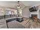 Spacious living room featuring vaulted ceiling, a fireplace, and open access to the dining room at 5228 Boone Ct, Villa Rica, GA 30180