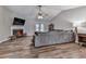 Comfortable living room with fireplace, wood floors and vaulted ceiling with fan at 5228 Boone Ct, Villa Rica, GA 30180