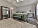 Spacious primary bedroom with tray ceiling, rug, and ample natural light at 5228 Boone Ct, Villa Rica, GA 30180