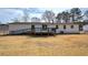 Backyard with a deck and large grassy area at 62 W Lakeview Dr, Temple, GA 30179