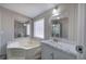 Bathroom with soaking tub, vanity, and modern lighting at 62 W Lakeview Dr, Temple, GA 30179