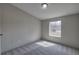 Cozy bedroom featuring a neutral color scheme, plush carpeting and a bright window at 62 W Lakeview Dr, Temple, GA 30179