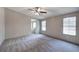 Spacious bedroom with carpet, ceiling fan and ensuite bathroom at 62 W Lakeview Dr, Temple, GA 30179