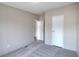 Bedroom featuring plush carpeting, light-colored walls and two entry doors at 62 W Lakeview Dr, Temple, GA 30179