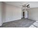 A spacious bedroom with modern wood-look flooring, neutral paint, and ceiling fan at 62 W Lakeview Dr, Temple, GA 30179