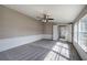 Bright bedroom features a ceiling fan, neutral carpet and natural light at 62 W Lakeview Dr, Temple, GA 30179