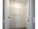 Walk-in closet with shelving and carpeting, perfect for organizing all your clothes at 62 W Lakeview Dr, Temple, GA 30179