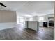 View of the kitchen with stainless steel appliances, an island and an open floor plan at 62 W Lakeview Dr, Temple, GA 30179