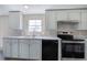 Bright kitchen featuring stainless steel appliances, durable countertops, and plenty of natural light at 62 W Lakeview Dr, Temple, GA 30179