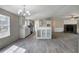 A view of the kitchen and living room with an island, stainless steel appliances, and a fireplace at 62 W Lakeview Dr, Temple, GA 30179