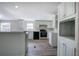 Modern kitchen with an island, stainless steel appliances, and light cabinets, perfect for entertaining at 62 W Lakeview Dr, Temple, GA 30179