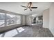 Spacious living room with lots of natural light and an open floor plan to the kitchen at 62 W Lakeview Dr, Temple, GA 30179