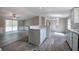 Open-concept living space featuring a kitchen counter, dining area and living room, perfect for Gathering gatherings at 62 W Lakeview Dr, Temple, GA 30179