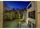 Evening view of home exterior with grassy backyard at 700 N Island Dr, Atlanta, GA 30327