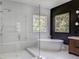 This bathroom features a walk-in shower, a freestanding tub, and a modern vanity at 700 N Island Dr, Atlanta, GA 30327