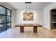 Open dining room featuring modern lighting fixture, hardwood floors and a large window at 700 N Island Dr, Atlanta, GA 30327