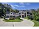 Stately home with a three-car garage, circular drive and professionally landscaped lawn at 700 N Island Dr, Atlanta, GA 30327
