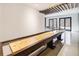 Large game room with shuffleboard table, ping pong table, and modern ceiling design at 700 N Island Dr, Atlanta, GA 30327
