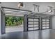 Spacious three car garage with modern doors and epoxy flooring at 700 N Island Dr, Atlanta, GA 30327