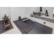 Home gym with mirrored wall, exercise mats, rollers, blocks, and rowing machines at 700 N Island Dr, Atlanta, GA 30327