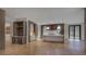 Contemporary kitchen with gray cabinetry, marble countertops, wine storage, and hardwood floors at 700 N Island Dr, Atlanta, GA 30327