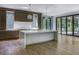 Bright kitchen with a white waterfall island, stainless steel appliances, and hardwood floors at 700 N Island Dr, Atlanta, GA 30327