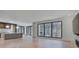 Open concept layout featuring a modern kitchen with large windows and hardwood floors at 700 N Island Dr, Atlanta, GA 30327