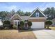 Charming brick and siding home with well-manicured front yard and two-car garage, perfect for suburban living at 339 Southgate Dr, Locust Grove, GA 30248