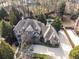 Aerial view of house with a large backyard, lush landscaping, and a pristine pool at 3871 Trickum Road Ne, Marietta, GA 30066