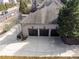 Overhead view of the home's three-car garage with an expansive driveway at 3871 Trickum Road Ne, Marietta, GA 30066