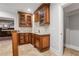 Basement bar area with a sink, cabinetry, wine racks, and tile backsplash at 3871 Trickum Road Ne, Marietta, GA 30066