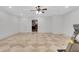Finished basement with tile floors, a ceiling fan, and an exercise bike at 3871 Trickum Road Ne, Marietta, GA 30066