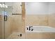 Bathroom featuring a tub and a glass-door shower with tiled walls at 3871 Trickum Road Ne, Marietta, GA 30066
