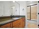 Bathroom with granite countertop vanity and tiled shower with glass doors at 3871 Trickum Road Ne, Marietta, GA 30066