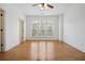 An empty bedroom featuring hardwood floors, a large window, and white walls at 3871 Trickum Road Ne, Marietta, GA 30066