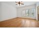 Bedroom with hardwood floors, white walls, and multiple windows at 3871 Trickum Road Ne, Marietta, GA 30066