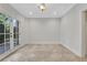Bright bonus room featuring tile flooring, French doors, and ample natural light at 3871 Trickum Road Ne, Marietta, GA 30066