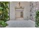 Exterior stone entryway with transom window offers natural light to lower level room at 3871 Trickum Road Ne, Marietta, GA 30066