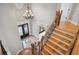 Grand foyer with a decorative tile inlay, chandelier, and elegant staircase at 3871 Trickum Road Ne, Marietta, GA 30066